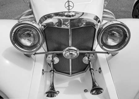 Mid-size luxury car Mercedes-Benz front, close-up details, black and white, The oldtimer show....