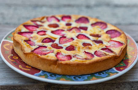 Homemade strawberry cake on a plate. Close up, selective focus, blurred, nobody.の写真素材