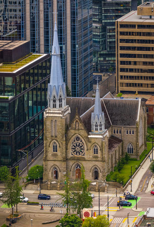The Holy Rosary Cathedral, Downtown Vancouver, Canada. Beautiful exterior of the Holy Rosary Cathedral. Headquarters of a Catholic Church-July 10,2022-Travel photoのeditorial素材