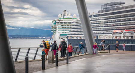 Cruise ship in Vancouver harbor British Columbia Canada. Cruise Ship Parked at Canada Place in Coal Harbor with Downtown City in Background-July 10,2022. Travel photography, selective focusのeditorial素材