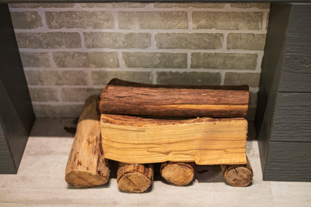 fireplace. Firewood indoor prepared for fire. Solid fuel and heating concept. Nobody, selective...