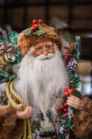 Santa Claus with gifts toy. Close-up of santa claus doll, santa claus statue with christmas decorations and gifts. Winter holidays concept, Nobody, selective focus.の写真素材