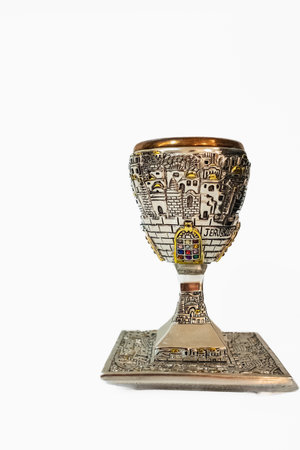 Shabbat kiddush cup. Top view image of jewish wine cup for wine. passover holiday and sabbath concept. Silver goblet isolated on a white background, nobody, copyspace for textの写真素材