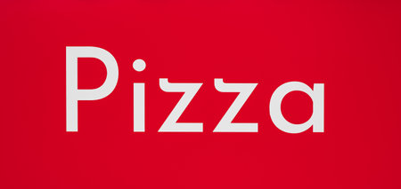 Inscription pizza isolated on red background. Pizza word written on board. banner design. Nobody, selective focusの写真素材
