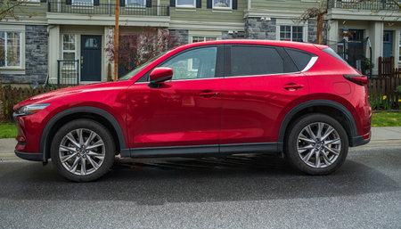 Mazda CX-5 parked on a street. Mazda CX-5 in red metallic colour, AWD. Exterior of a Mazda car. Editorial, nobody, street photo-Vancouver Canada-April 21,2023のeditorial素材