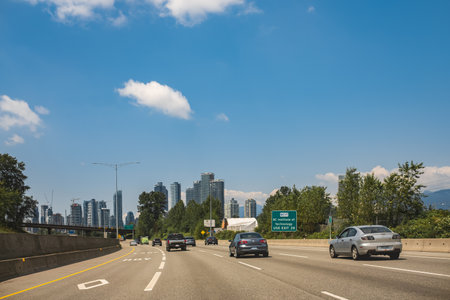 Vehicles travel along on Highway at the intersection of Trans-Canada Highway BC-1 near Burnaby BC...