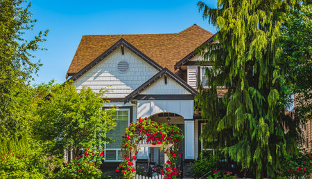 Beautiful exterior house in rural suburban neighborhood. Real Estate Exterior Front House on a sunny day. Big house with nicely landscaped front yard. Beautiful house entrance.