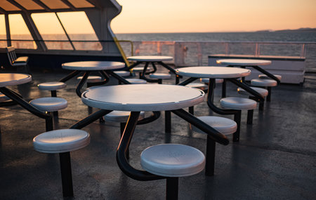 Interior of the ferry. Ferry furniture. Empty seats without passengers. Sea transport, deck chairs and tables on the cruise shipの写真素材