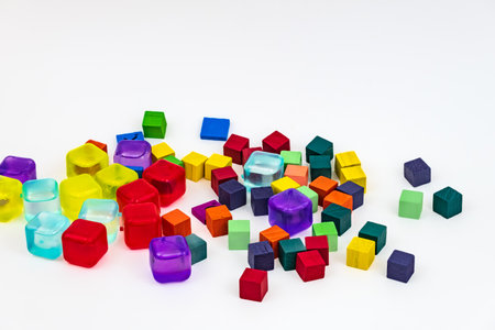 Mix of colored wooden and plastic blocks isolated on white background. Abstract. Spectrum of color...