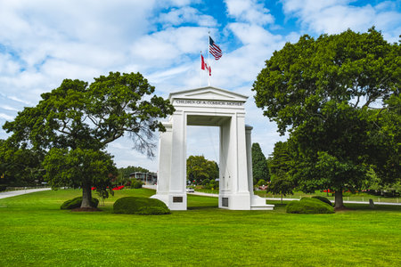 The gate monument in Peace Arch Park, Blaine, Washington, USA.Two countries flags on the monument in Peace Arch Park. USA Canada border. Historical landmark in Surrey, British Columbia-August 30, 2023のeditorial素材