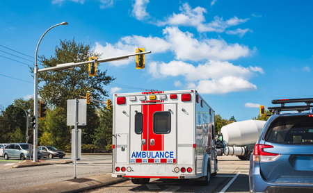 An ambulance has responded to an emergency call in the Vancouver suburb. Vancouver ambulance car and BC Ambulance Service helping people. Street photo Canadaの写真素材