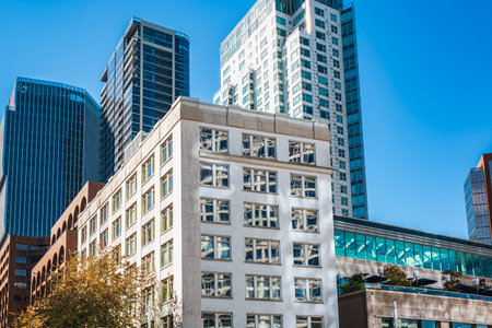 Skyscape of a group of modern office buildings in Vancouver BC. New area with new multi-storey...