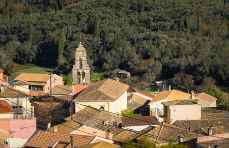 Beautiful view of village in Corfu Greece. village in mountains covered with forest. A traditional village with red clay rooftops.の写真素材