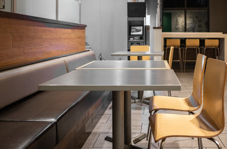 Spacious dining area with a communal table and comfortable seating in a restaurant. Table Top wooden...