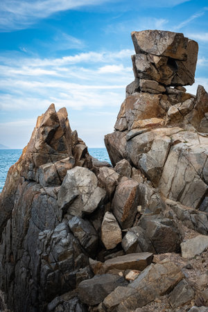 Coastline in Nha Trang Vietnam with rocky shore. Cliff and sea, rocky shore, rock formation. travel photo, nobodyの写真素材