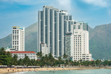 View of central beach of Nha Trang, Vietnam. Beautiful sand tropical beach in coastal city. Scenic coastline. Cityscape Nha Trang is a popular tourist destination of Asia-March 28,2024のeditorial素材