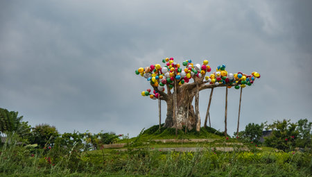 Colorful Paper Lanterns hanging on a big tree in the park Hoi An Vietnam. Colorful paper lanterns...