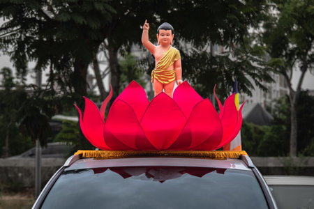 A holy child Buddha in red lotus flower, Gautama Buddah birthday celebration day. Visakha Bucha Day water Lilly lotus flower. Buddha's birthday meditation relax concept background Vesak dayの写真素材
