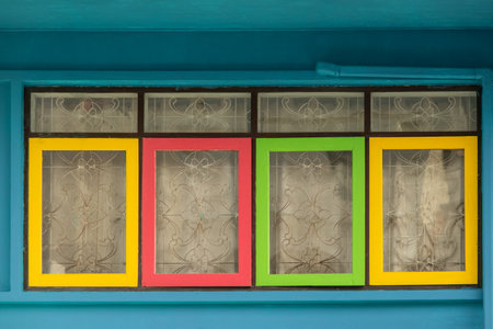 Background of colorful old windows in old town. Close up view of colorful windows with curtains. Travel photo, nobodyの写真素材