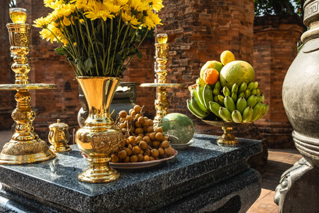 Fruit Offerings at a Thai Temple. An offering of fruit, flowers and bananas arrangements at a Temple Thailand. Offer various kinds of fruits on altar for religious ceremony in Buddhist templeの写真素材