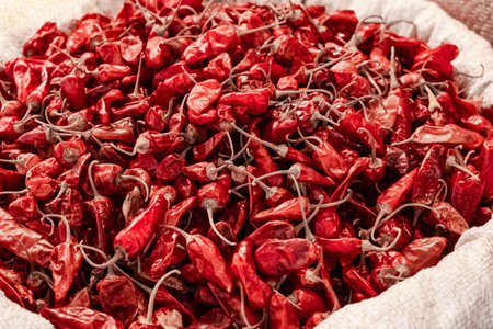 Dry hot chili peppers. Red Hot chili in a street market for sale. Red grained pepper spice. Colorful...