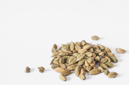 Heap pile of Dried cardamom seeds, top view. Cardamon seeds close up for background. Dry Kardamon, Cardamum Spice , Genera Elettaria Beans, Cardamomum Seasoning. Copy space for textの写真素材