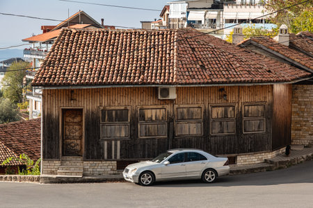 Street view of the old town of Kruja Albania. An old houses with red tiles roof and car parked in front. Historical site in Albania. Travel photo, nobodyの写真素材