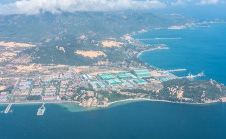 Cam Ranh Bay Khanh Hoa beautiful coastal landscape Vietnam. Residential area and industrial port, business logistic export import. Aerial view pristine beaches with blue water and white sand dunesの写真素材