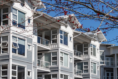 Residential modern townhouses on sunny day. Facade of Low rise Flats Apartment Building. New Living Building Complex Vancouver Canada. Real estate development, house for sale, housing marketの写真素材