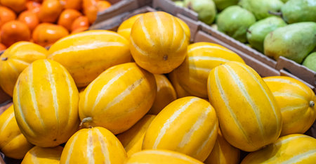 Fresh organic fruit Oriental striped melon. Korean Melon or oriental melon on display in a local famer market. Nobody, close upの写真素材