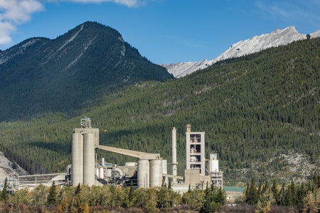 Cement Plants manufacturing in Canada. Industrial cement plant in Alberta, Canada. Mountain view in autumn. Travel photo.の写真素材