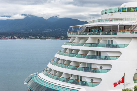 Cruise liner cabins and balconies. Side view of a cruise ship docked in the port of Vancouver...