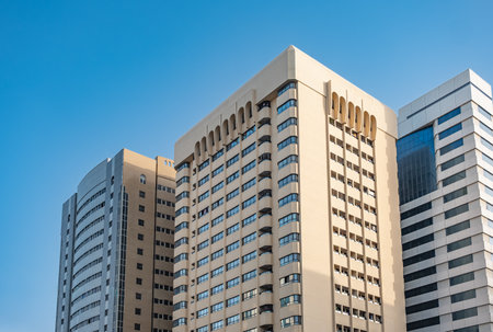 Modern residential apartment with flat buildings exterior. New luxury house and home complex. Real estate property, condo architecture with Blue sky. Residential area with modern apartment buildingsの写真素材