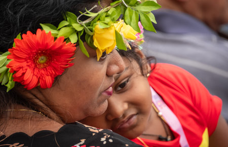 Mother hugging daughter. Asian Indian mother holding her child baby girl cute daughter smiling. Intimate mother-daughter connection. Close up of mother hugging daughter-Goa India-June 24,2025のeditorial素材
