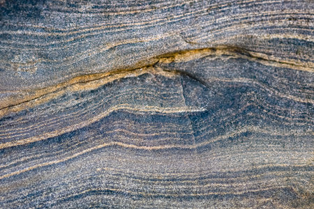 Blue rock stone material with weathered texture. Close up blue color natural stone textured surface....
