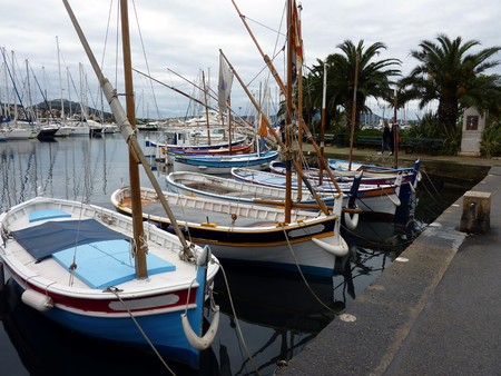 Small boats at Sanary-sur-mer port by cloudy weather, south of Franceの写真素材