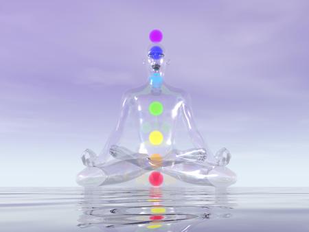 Transparent man made of glass meditating with seven colorful chakras inside upon oceanの写真素材