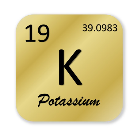 Black potassium element into golden square shape isolated in white backgroundの写真素材