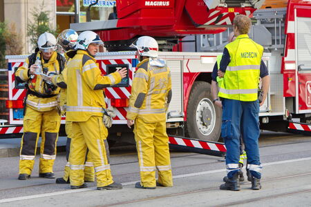 GENEVA, SWITZERLAND, AUG 22 : Firemen and medical team next to firetruck discussing intervention in...