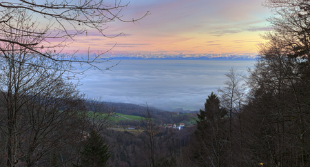 Alps mountains upon clouds by sunset, France, HDRの写真素材