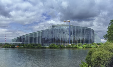Back of European Parliament building in Strabourg and Ill river by cloudy day, Franceの写真素材
