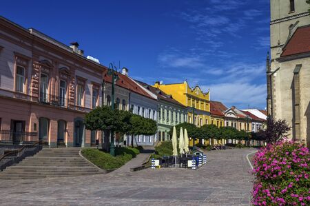 Historic houses and St. Nicolaus Church by day, Presov, Slovakiaの写真素材