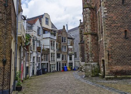 Old street full of houses in Gouda, Netherlandの写真素材