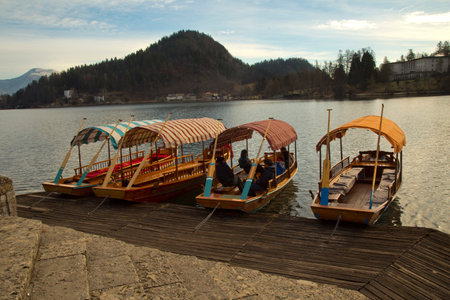 SLOVENIA, 30 DECEMBER 2018. Traditional Pletna boats on lake Bled (Blejsko jezero).のeditorial素材