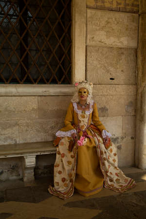 ITALY, VENICE, 22 FEBRUARY 2020. Woman in traditional costume and mask at the Venice Carnival, Italy.のeditorial素材