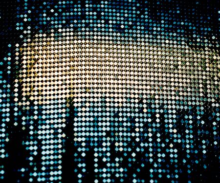 abstract luminous blurred goldy, blue and black backgroundの写真素材