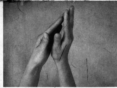 Upraised hands forming universal prayer "mudra".の写真素材