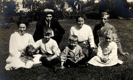 Vintage Generations. Family with grandparents, parents, and children. Circa 1910 print has scratches,  fading,  artifacts, and solarization qualities.の写真素材