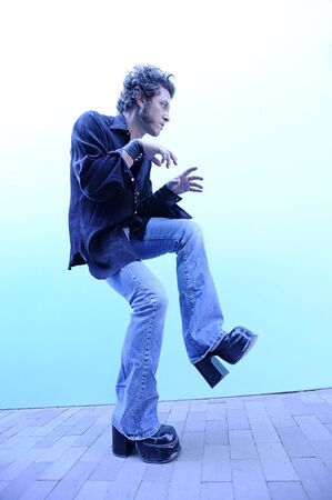 Elevated man stepping out in a strange way. の写真素材