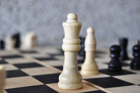 Chess board with white queen in the middleの写真素材